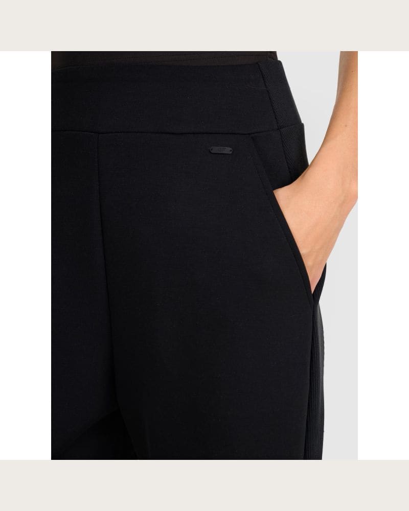 Dámske tepláky 4F TROUSERS CAS F1180-WAW25TTROF1180-21S-BLACK – fotka 6