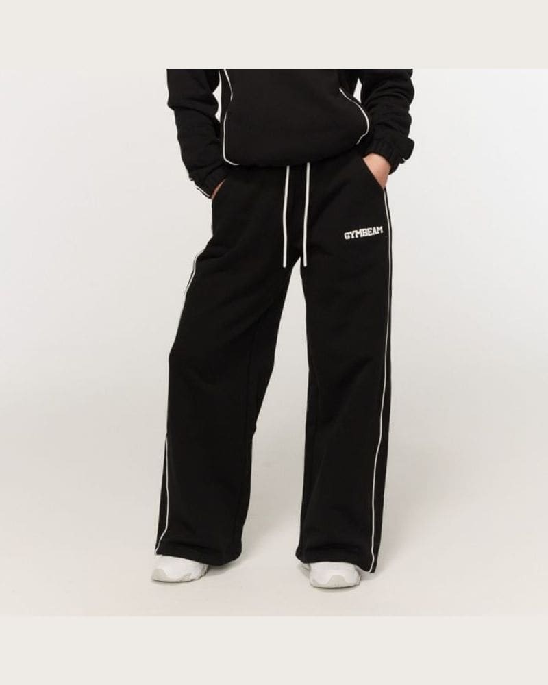 GymBeam Dámske tepláky Varsity Black XS